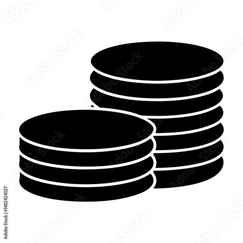 Two stacks of coins, illustrating savings, wealth and monetary concepts