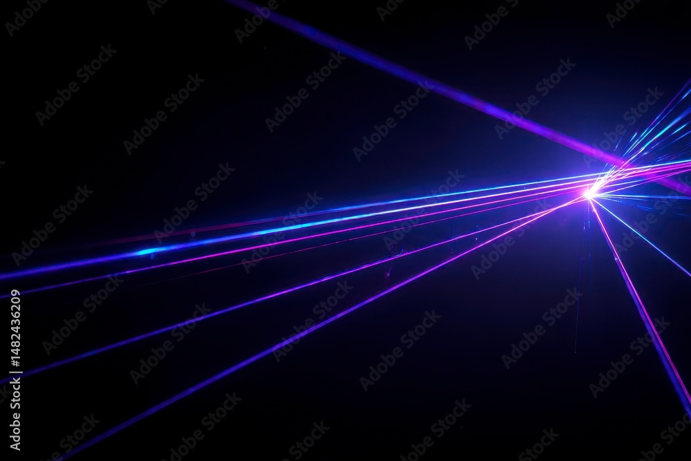 Blue and violet beams of bright laser light shining on black background
