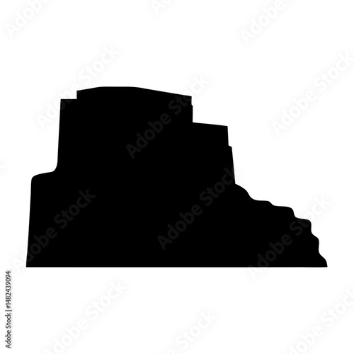 Black silhouette of rock formation with flat top and wavy edge