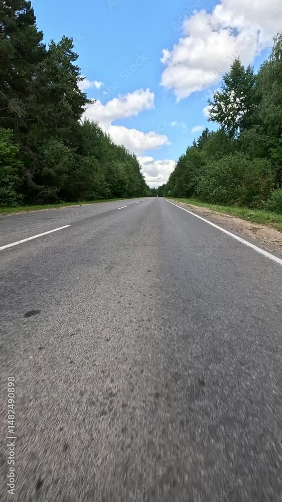Video shooting in motion, driving a red car over the road along the asphalt at speed, view from the wheel. Video shooting in motion, driving a red car over the road along the asphalt at speed, view from the wheel.