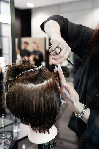 Practice with mannequins, scissors, brushes, and modern salon equipment. Ideal for illustrating hairdresser education, advanced courses, skill development, and beauty industry masterclasses.