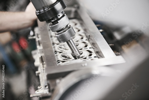 Engine Valve Seat Repair in car workshop close up.