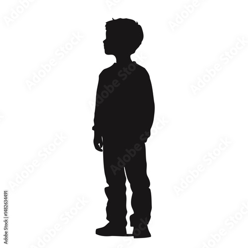 Silhouette of Young Boy Standing and Looking Up