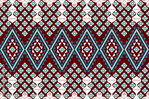 Close-up of handcrafted Asian silk scarf with vivid colors and ornate yarn detailing.