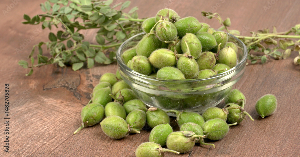 custom made wallpaper toronto digitalFresh Green chickpeas on a branch, and in the pod, isolated on wooden background.