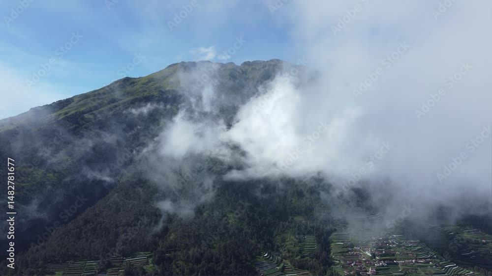 Epic Aerial Majesty: Breathtaking Drone View of Mountain Peaks Above the Clouds Epic Aerial Majesty: Breathtaking Drone View of Mountain Peaks Above the Clouds