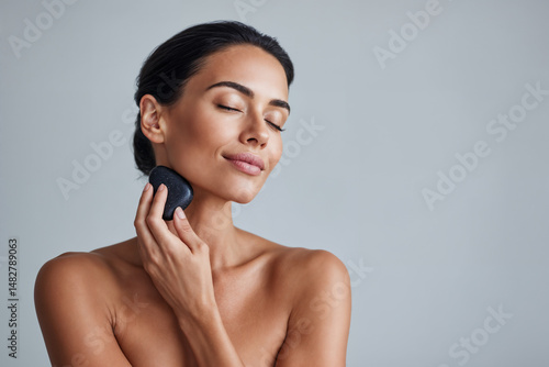 Glowing skincare routine with stone massage for radiant beauty