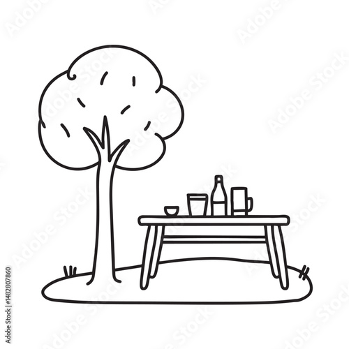 A table placed under a tree in a backyard picnic