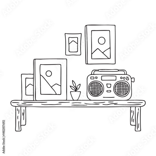 A tape recorder beside photo frames on a coffee table