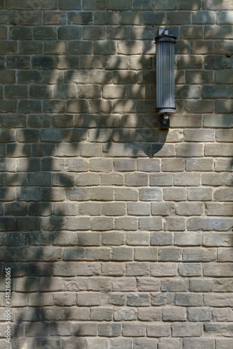 Tree shadow on gray brick wall. Industrial original background.