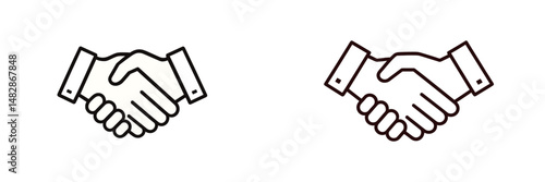 Two hands shaking in a gesture of agreement during a business meeting in a bright office space in the morning