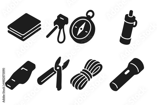 Essential tools for outdoor adventures featuring a compass, flashlight, and multi-tool