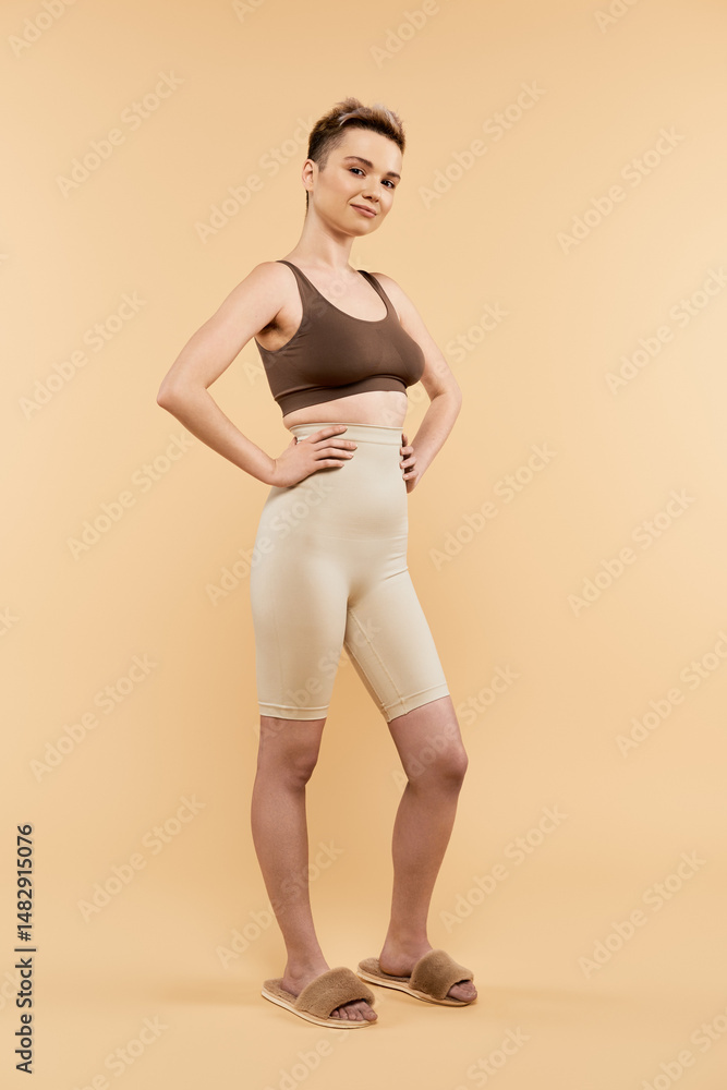 Confident young woman embracing body positivity in stylish activewear for self love Confident young woman embracing body positivity in stylish activewear for self love