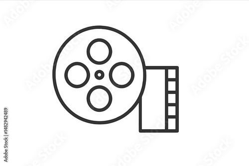 Vintage film reel showing classic movie film strip on a white background during a quiet evening