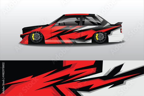 Stylish modified car with bold graphics in studio