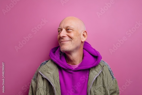 Bald man with a content smi...