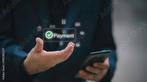 Wallpaper Mural Man using smartphone for online payment with secure transaction, digital wallet system, and mobile banking concept for financial technology, e-commerce, and global money transfer. Torontodigital.ca