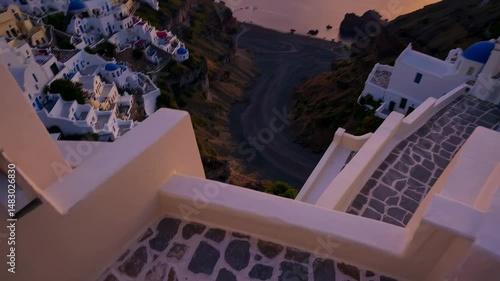 Greece's Santorini island is showcased at sunrise with a beautiful panorama and dramatic sky