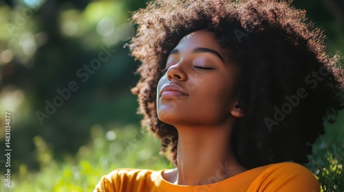 Young african female relaxing outdoors in sunlit garden serenity