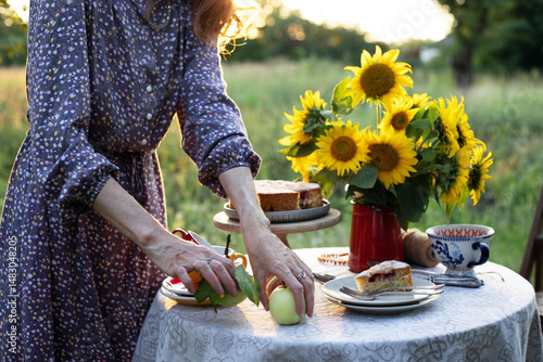 girl serving tea table in the garden