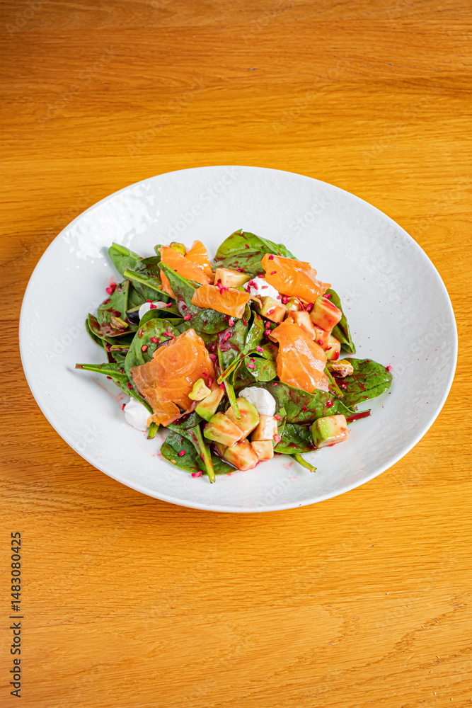 A delightful mix of spinach, smoked salmon, and vibrant toppings served in a serene atmosphere A delightful mix of spinach, smoked salmon, and vibrant toppings served in a serene atmosphere