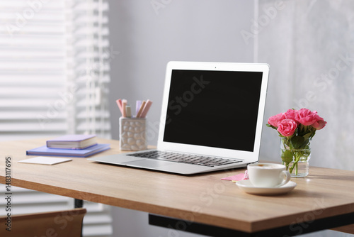 Wallpaper Mural Workplace with laptop and beautiful flowers in office Torontodigital.ca