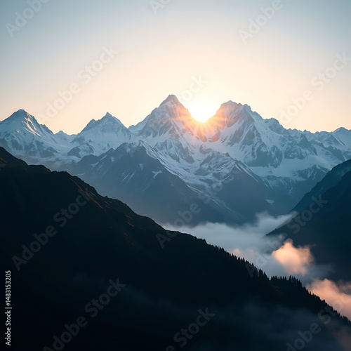 Epic Mountain Range at Sunrise with Snow-Capped Peaks and Atmospheric Fog