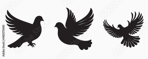 Silhouettes of three doves in different flight and standing positions, isolated on a white background, symbolizing peace, freedom, and grace.