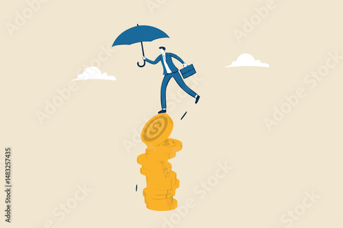 Financial stability, risk or trust, economic challenge, balance or reliability, money management, security or wealth accumulation concept, businessman hold umbrella balance on unstable coins stack.
