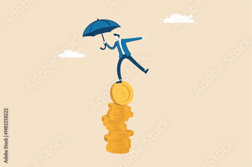 Financial stability, risk or trust, economic challenge, balance or reliability, money management, security or wealth accumulation concept, businessman hold umbrella balance on unstable coins stack.