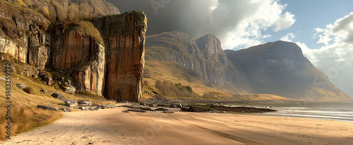 Dramatic coastal landscape featuring rugged cliffs and a sandy beach under a moody sky with mountains