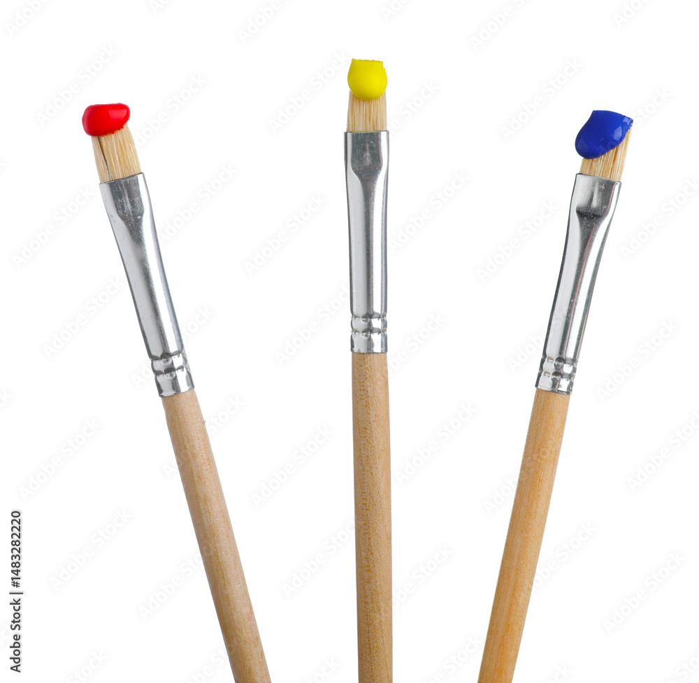 Fototapeta premium Brushes with different paints isolated on white