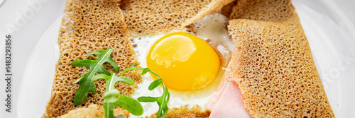 Quadro em tela Fried egg galette sarrasin fried egg in crepe Breton galette complete fresh deli
