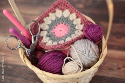 Basket with clews and granny square crocheted sample cozy photo hobby handmade craft crochet materials