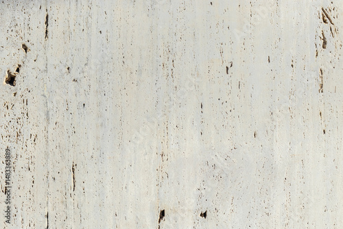 Close-up of travertine stone wall. Natural texture and pores. Great for design and architecture themes.