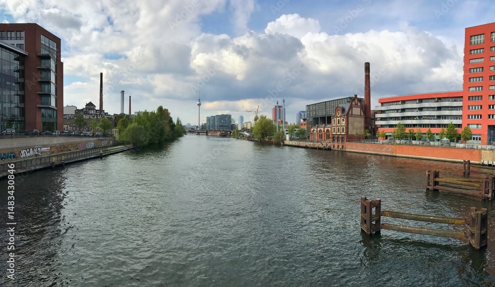 Obraz premium Urban river landscape with architecture and trees, panoramic Berlin view for headers