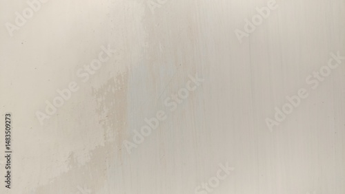 Photos photograph emphasizing the texture of a limewash wall where the paint is actively peeling and flaking, revealing the underlying surface and the process of deterioration