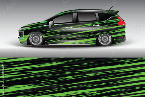 Sleek modified car with vibrant green graphics on display