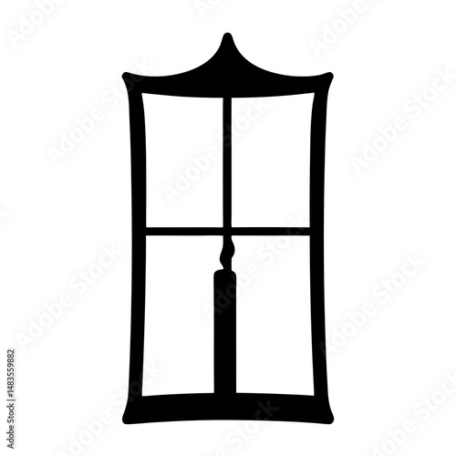 Black silhouette of a candle inside a vintage window frame with a pointed top