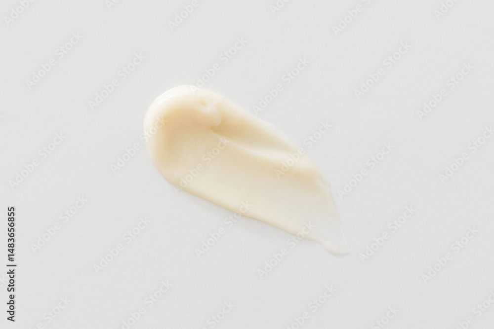 Fototapeta premium Beige cream smear on white background, shampoo, hair conditioner, shower gel or soap skincare product texture close-up