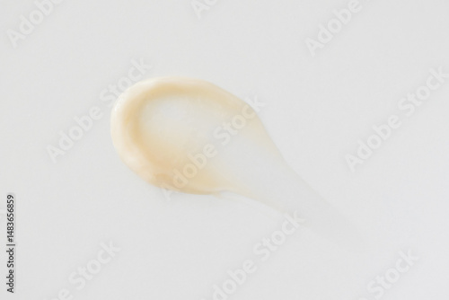 Minimalist beige smear cream on white background