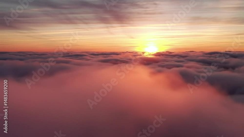 Wallpaper Mural Aerial view of the sun rising above a thick layer of clouds at dawn time Torontodigital.ca
