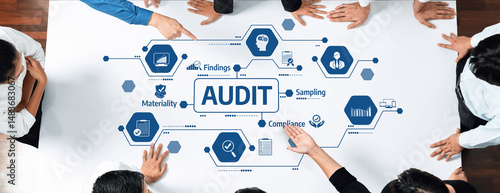 Photos This image depicts professionals collaborating in an audit process, highlighting essential elements like compliance, findings, and materiality within a business context
