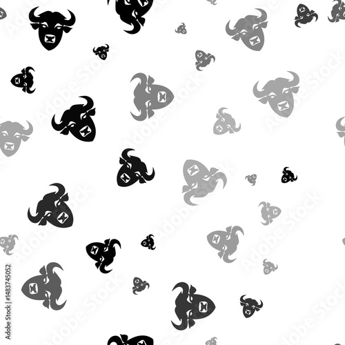 Seamless vector pattern with buffalo head symbols, creating a creative monochrome background with rotated elements. Illustration on transparent background