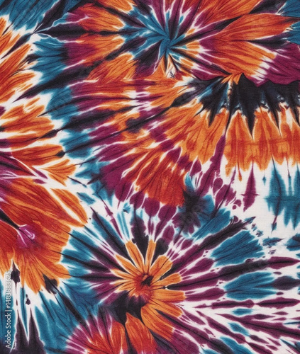 Tie dye shibori background. Colorful Tie Dye Spiral Design Tie dye textile print Swirl rainbow tie-dye wallpaper. Hippie boho tie-dye texture backdrop.
