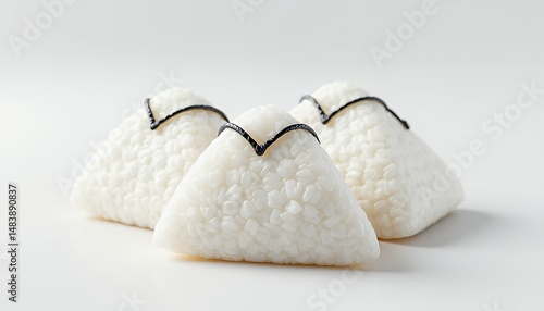 Obraz na płótnie Three 3d Rendered White Onigiri Rice Balls Isolated on White Background Featuring Black Decoration Perfect for Japanese Cuisine Themed Visuals and Culinary Decoration w salonie