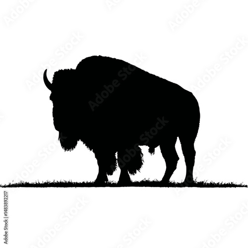 Solid black silhouette of a bison standing