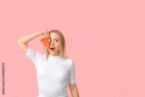 Young shocked woman holding...