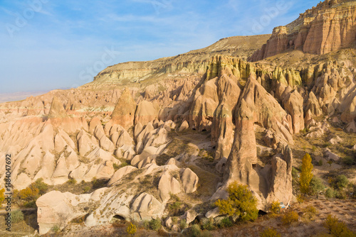 Cappadocia rock formation sites and chimneys. Kapadokya in Turkey, Love Valley. Tuff volcanic rock pillars and mushrooms in the museum under open sky in Cappadocia turkish famous tourist sight