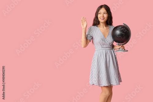 Young Asian woman with glob...